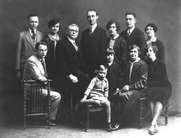The John W. Kleinhenz Family. 1927. Photo likely taken at 518 West Jackson Street in St. Marys, Ohio.
Standing: Arnold, Pauline, Ray, Hilda, Alfred, Olive, Esther (behind Edwin)
Seated: Leonard, John, Edwin, Catherine & Alfrida.