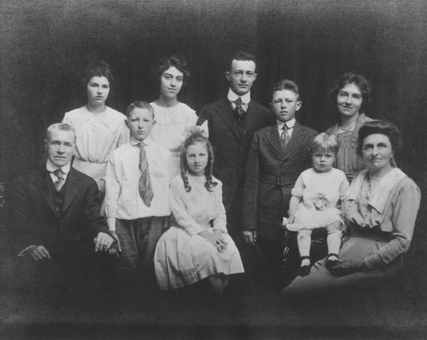 Alois J. Willke Family in 1918. L-R: Alois J. Willke, Lucille (Willke) Vehr, Al H. Willke, Marie (Willke) Goecke, Marcella (Willke) Austing, George Willke, Edgar Willke, Margie (Willke) Landen, Ada (Willke) Limke, Caroline (Vanderhorst) Willke.